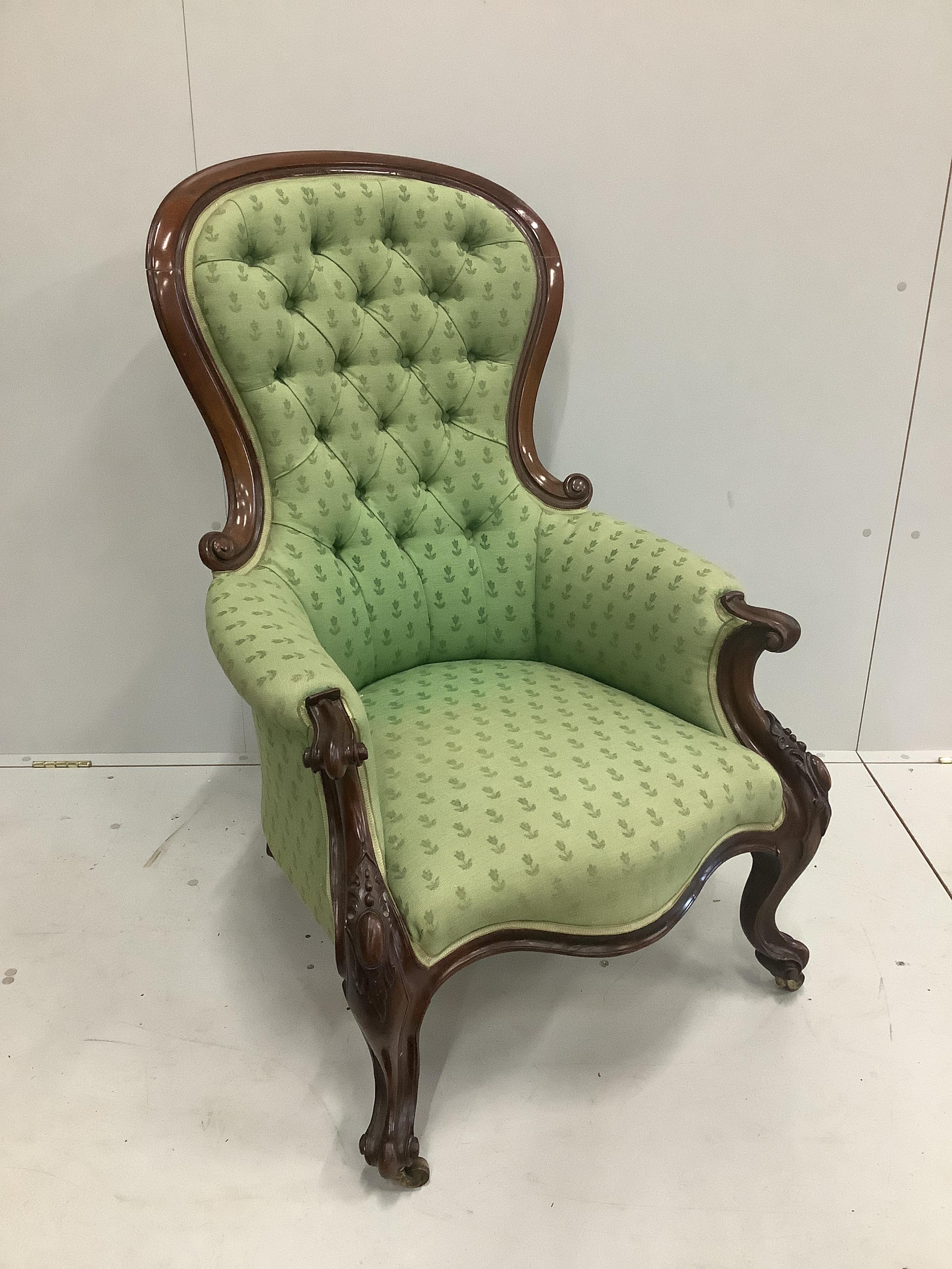 A Victorian carved mahogany button back armchair, width 70cm, width 70cm, height 109cm